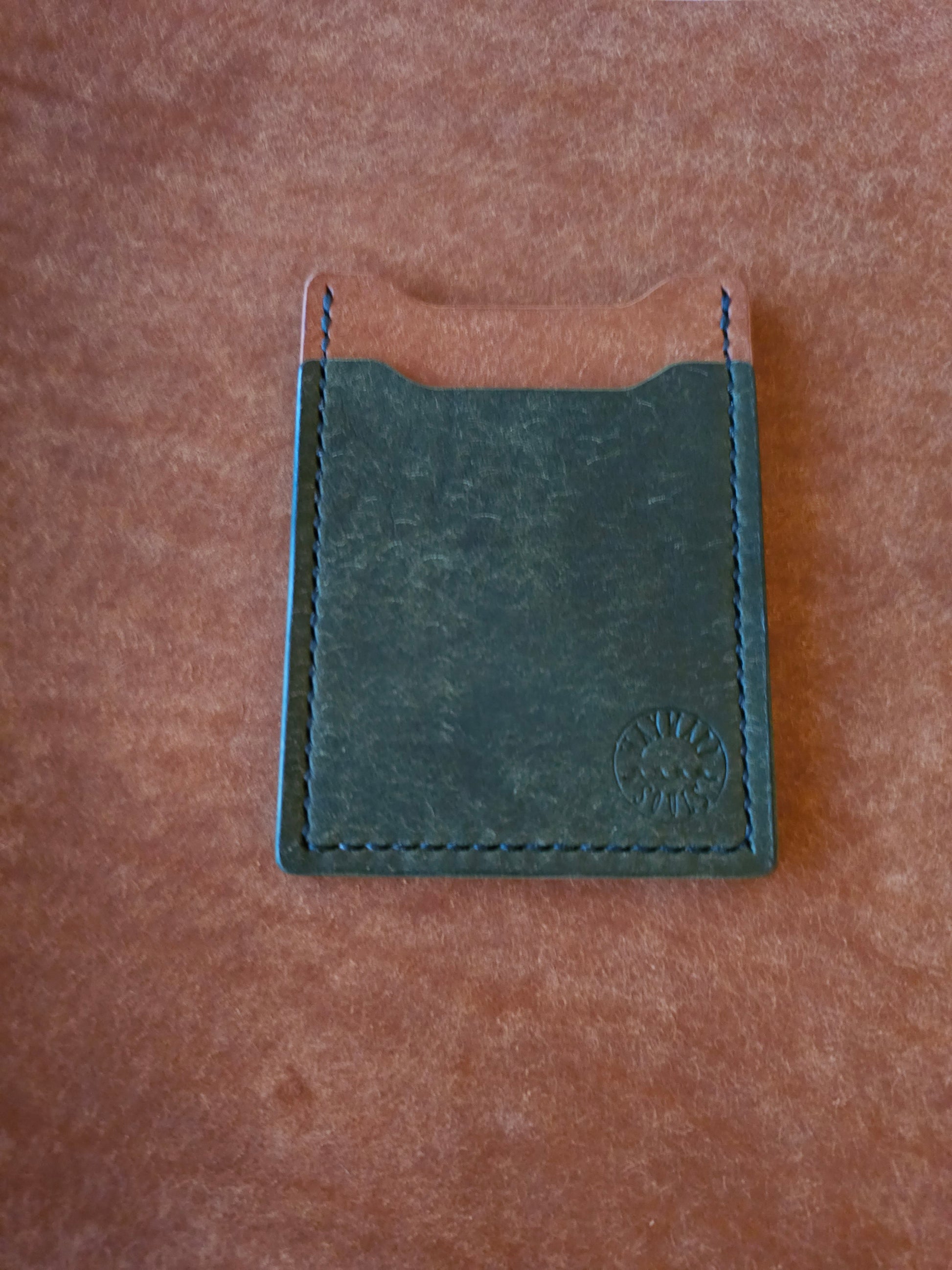 Leather card holder with angled pocket. Wayward Souls logo is stamped in the bottom right corner of the wallet.