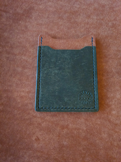 Leather card holder with angled pocket. Wayward Souls logo is stamped in the bottom right corner of the wallet.