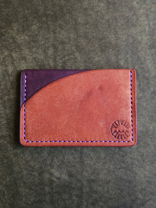 Leather card holder with angled pocket. Wayward Souls logo is stamped in the bottom right corner of the wallet.