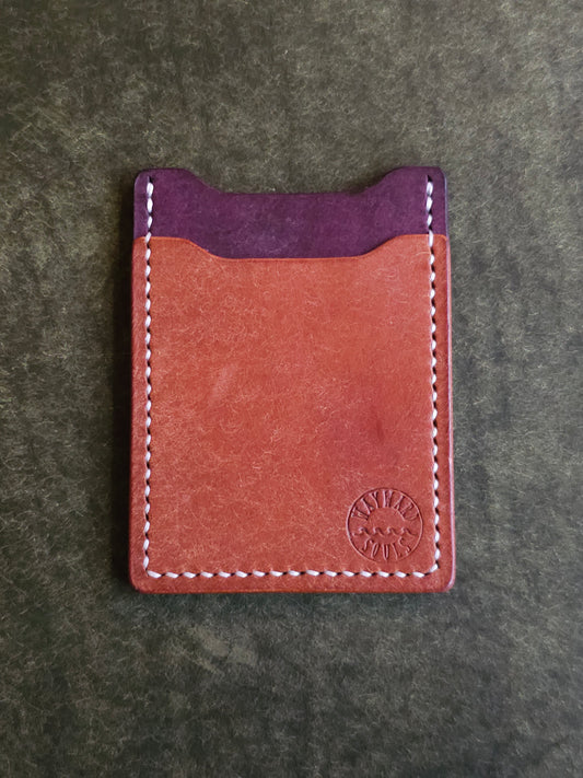 Leather card holder with angled pocket. Wayward Souls logo is stamped in the bottom right corner of the wallet.