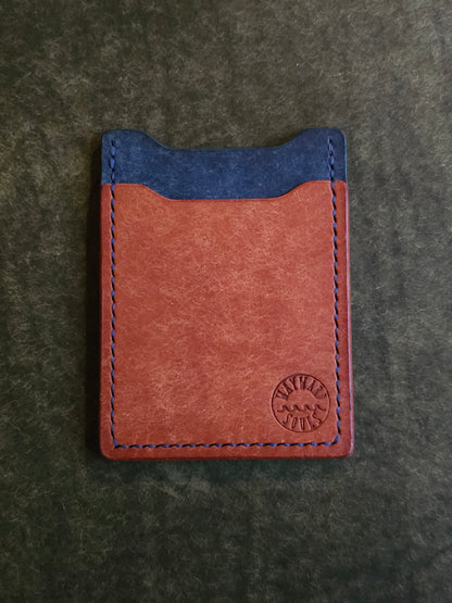 Leather card holder with angled pocket. Wayward Souls logo is stamped in the bottom right corner of the wallet.