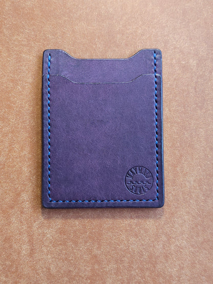 Leather card holder with angled pocket. Wayward Souls logo is stamped in the bottom right corner of the wallet.